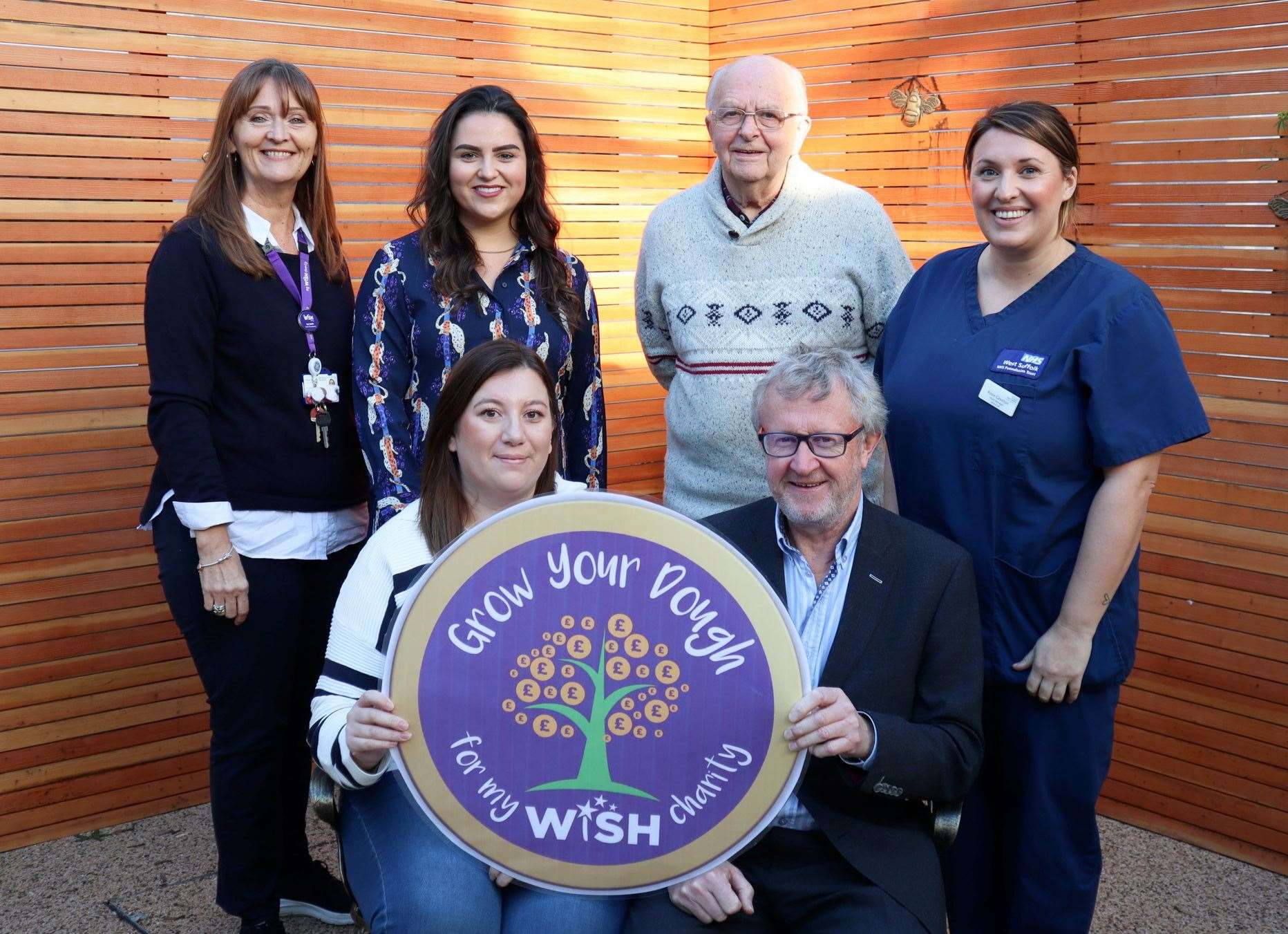 Sue Smith, My WiSH head of fundraising; Chloe Ludkin from Treatt; Arthur Clarke; Rosie Cawston, G4 ward manager. Front: Bianca Evans and Paul Knight from Knights Lowe. Photo: My WiSH Charity.