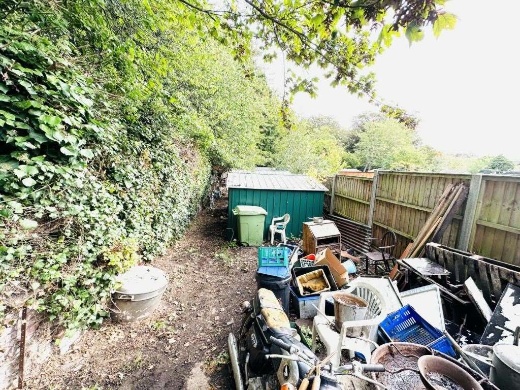 The back garden overloaded with waste at 38 Fornham Road, in Bury St Edmunds. Picture: Auction House East Anglia