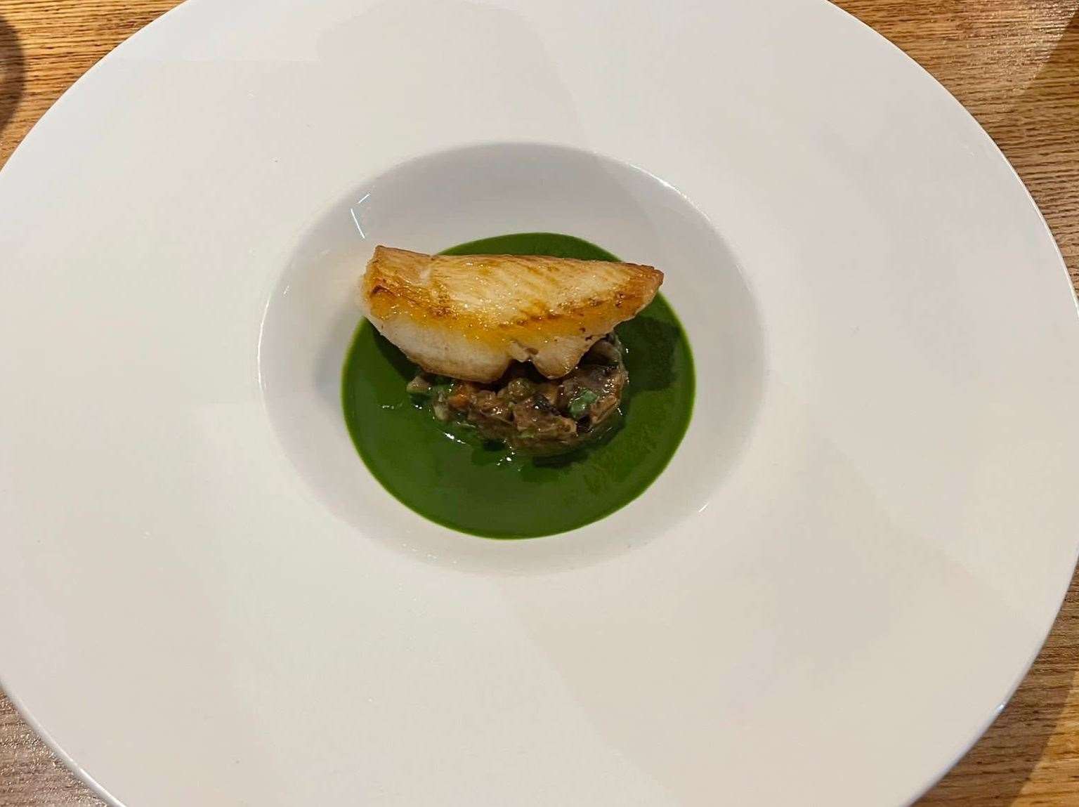 The fillet of halibut, snails, pearl barley and parsley. Picture: Chantelle Hurst