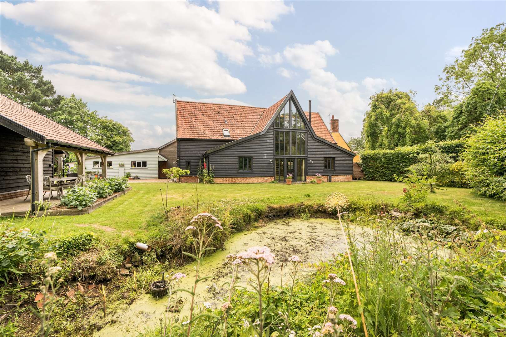 A Grade II listed barn conversion in Stowupland which has been restored is now on the market. Picture: Lacy Scott & Knight