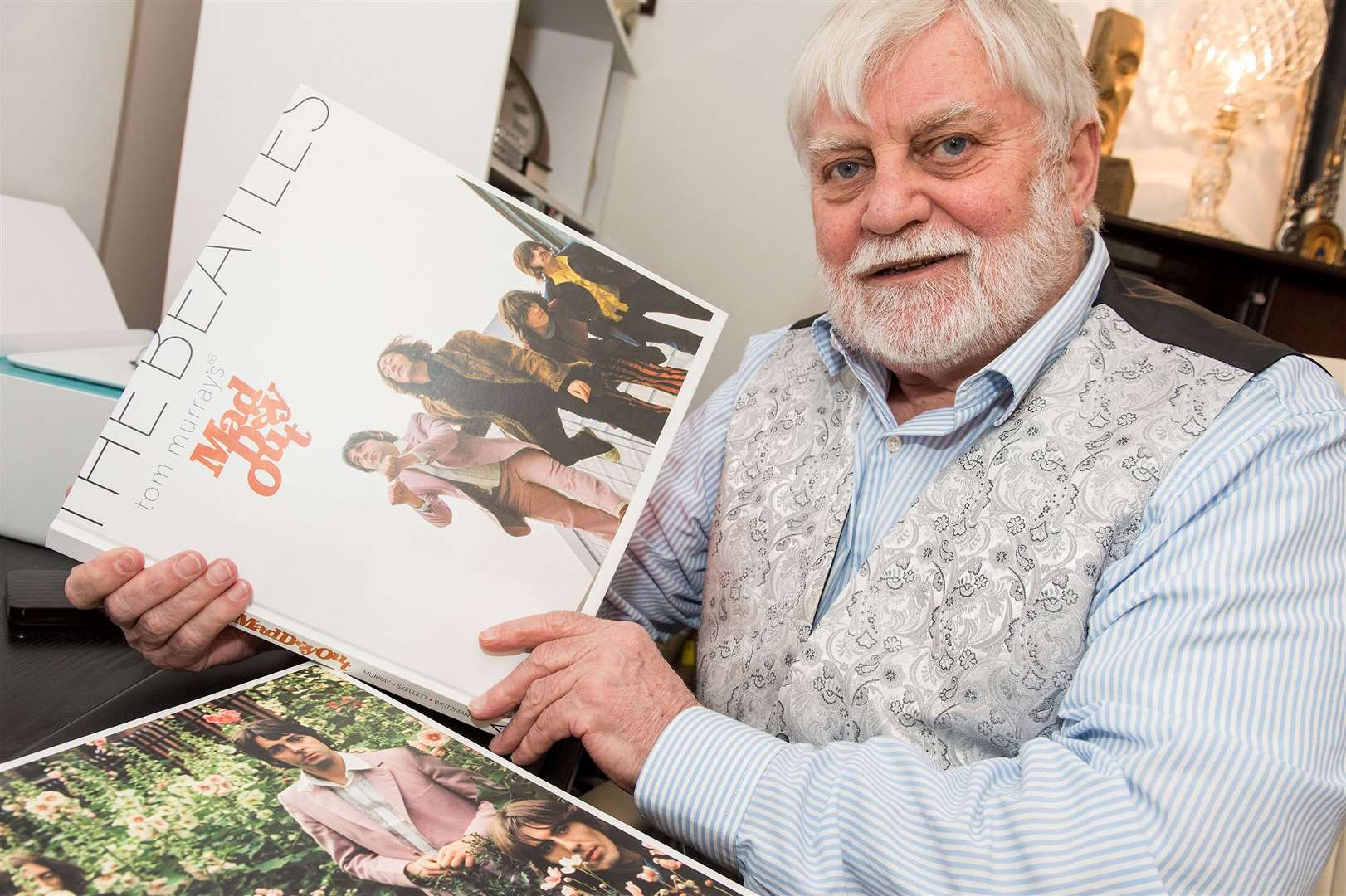 Photographer Tom Murray with his book: Mad Day Out. Picture Mark Westley