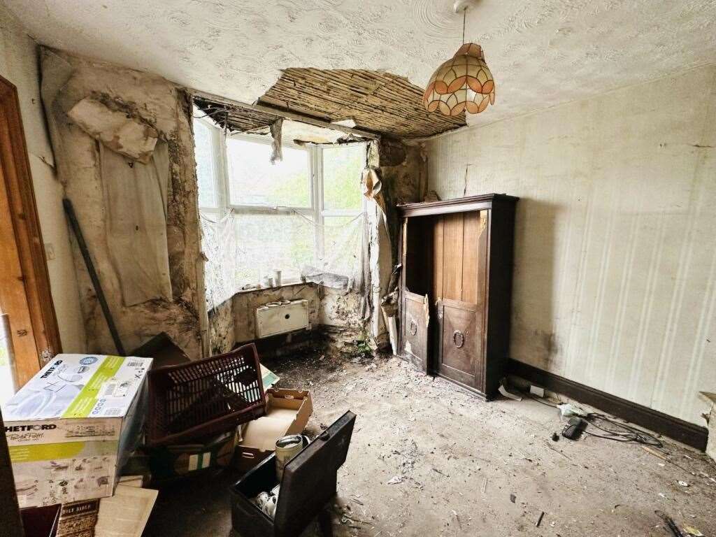 Ceilings and walls peeling in the living room at 38 Fornham Road, in Bury St Edmunds. Picture: Auction House East Anglia