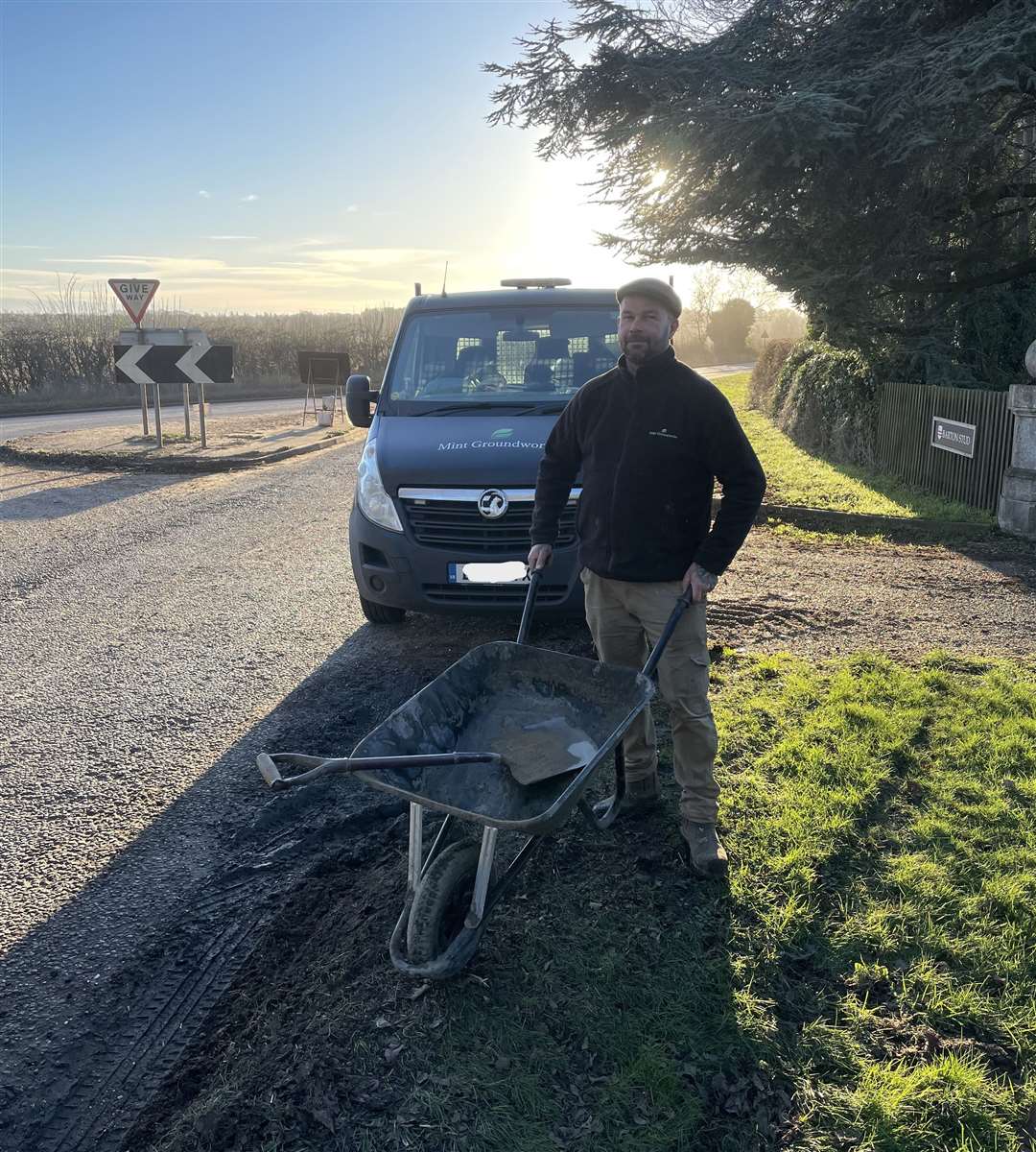 Tom Lamb used a wheelbarrow, spade and a tonne of crushed up tar to fill the potholes