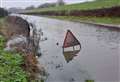 Flooding at major road closed for over a week made worse by vandalism