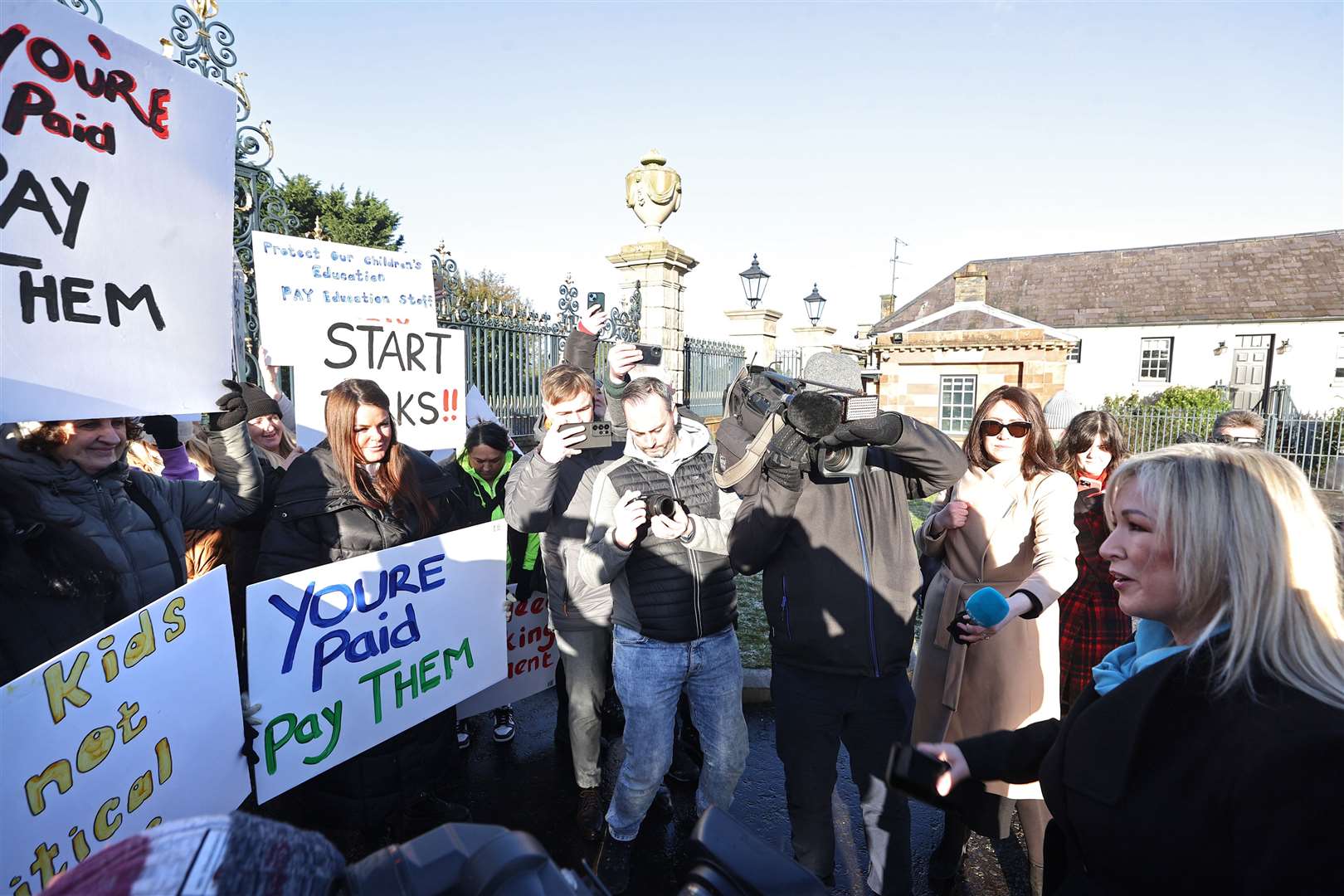 Sinn Fein vice-president Michelle O’Neill (right) speaks to protesters from the Colin Autism Support and Advice Group as they protest outside Hillsborough Castle on Monday (Liam McBurney/PA)