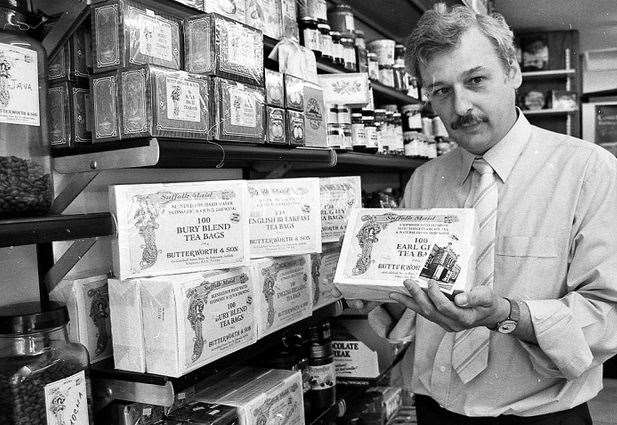 Robert Butterworth, in 1993, with the boxes of tea in which he placed his first cards