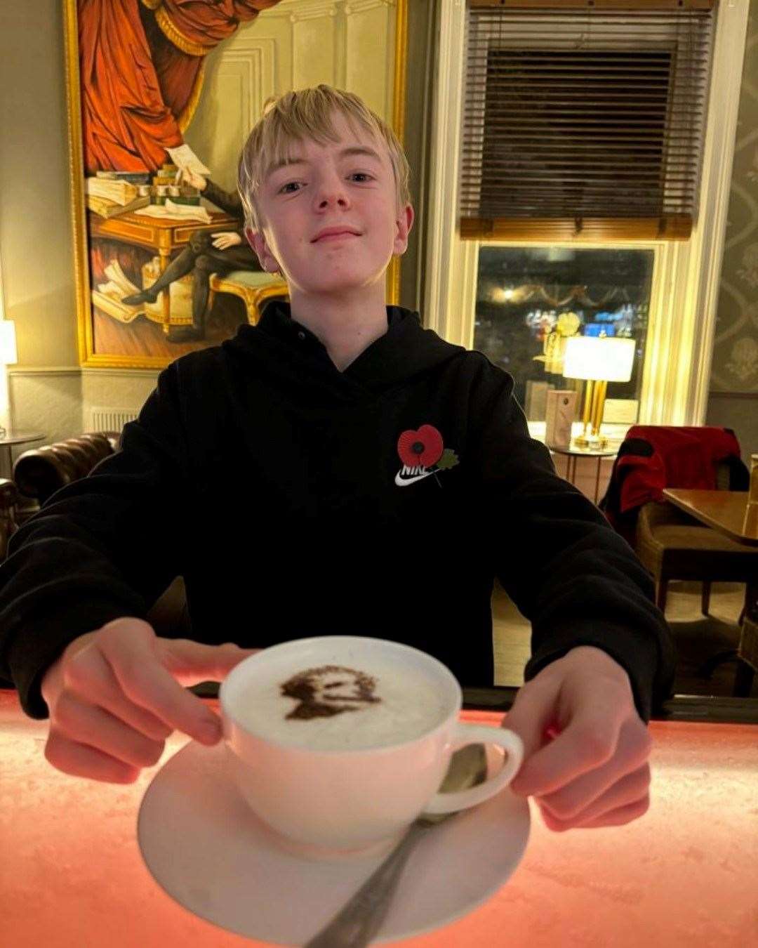 Oliver Locke at The Thomas Paine Hotel in Thetford with a coffee showing the work of his stencil. Picture submitted