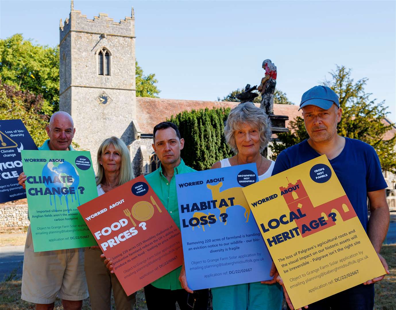 Palgrave, Norfolk, 13/08/2022..Palgrave residents protesting about the proposed solar farm on the outskirts of the village. Pictured from left Jeremy Moynihan, Anne Moynihan, Brad Greenfield, Pat Leigh and Leo Soares.. .Picture: Mark Bullimore Photography 2022.