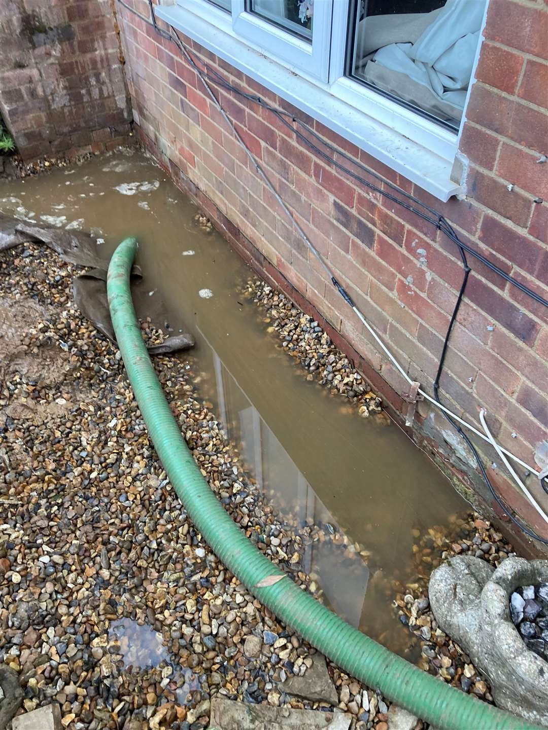 Mr Palmer has a submersible pump at his Tuddenham St Mary home to redirect water to nearby drains. Picture: Shaun Palmer