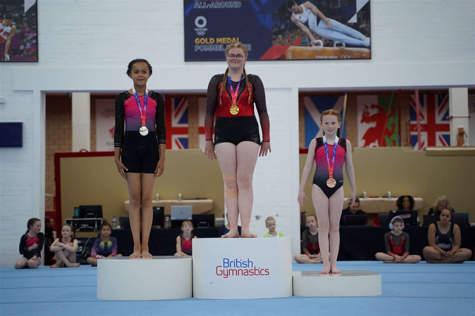 Grace Beales on the gold medal podium. Picture: British Gymnastics