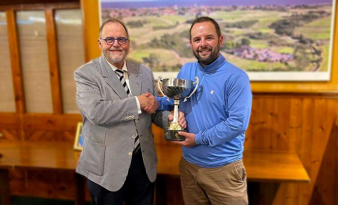 Terence Broome presenting Ben Kerr with the Suffolk PGA Championship trophy Picture: Trevor Mason