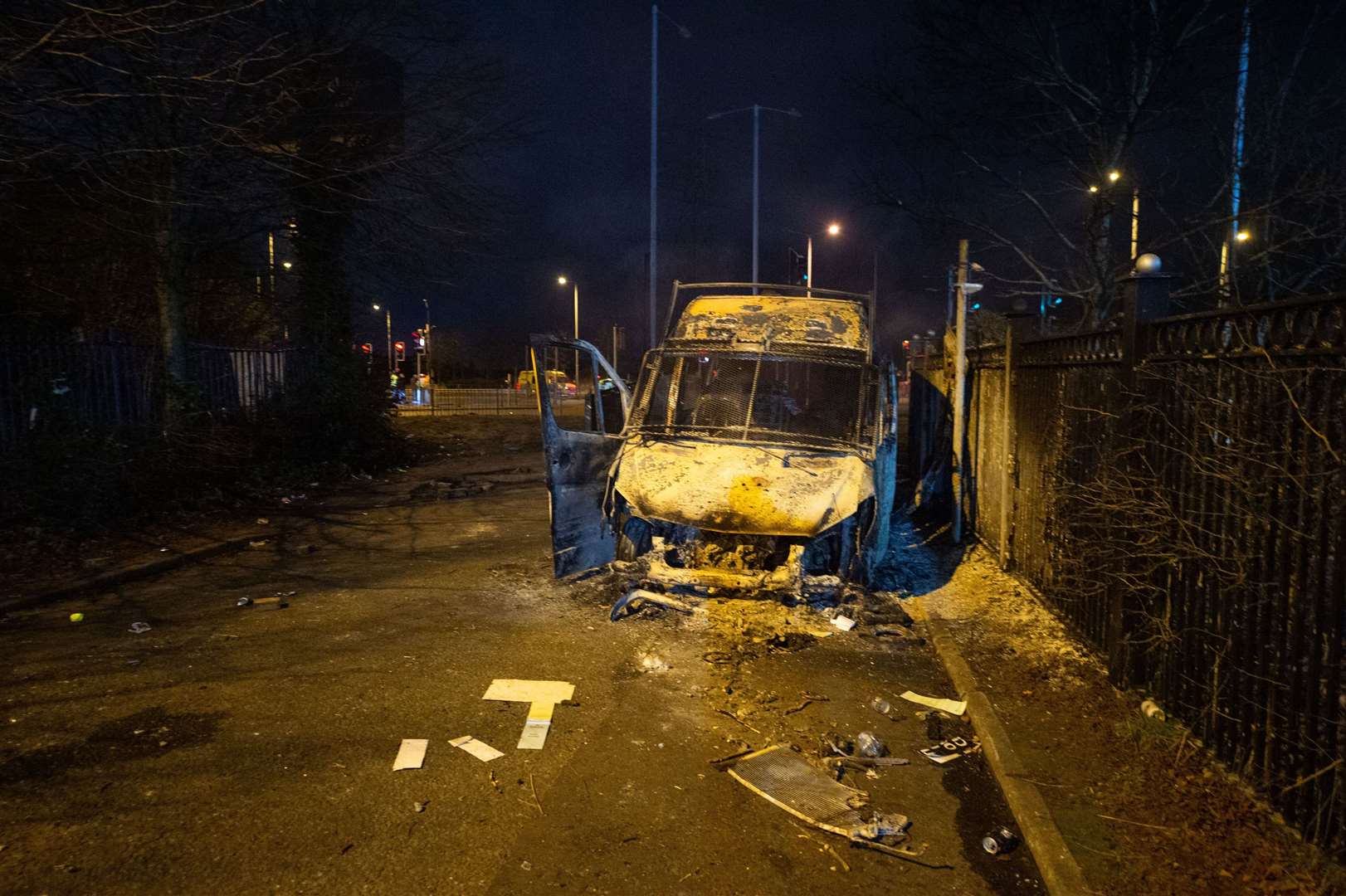 The burnt out police van after the demonstration outside the Suites Hotel in Knowsley, Merseyside (Peter Powell/PA)