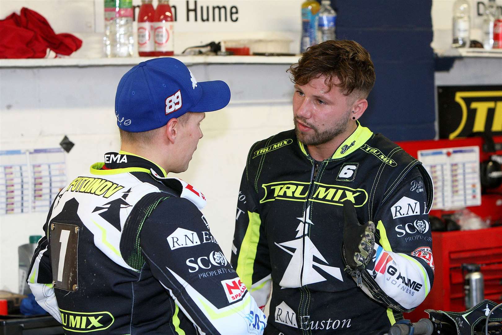 Danyon Hume chats to Emil Sayfutdinov in the Foxhall pits. Picture: Phil Hilton