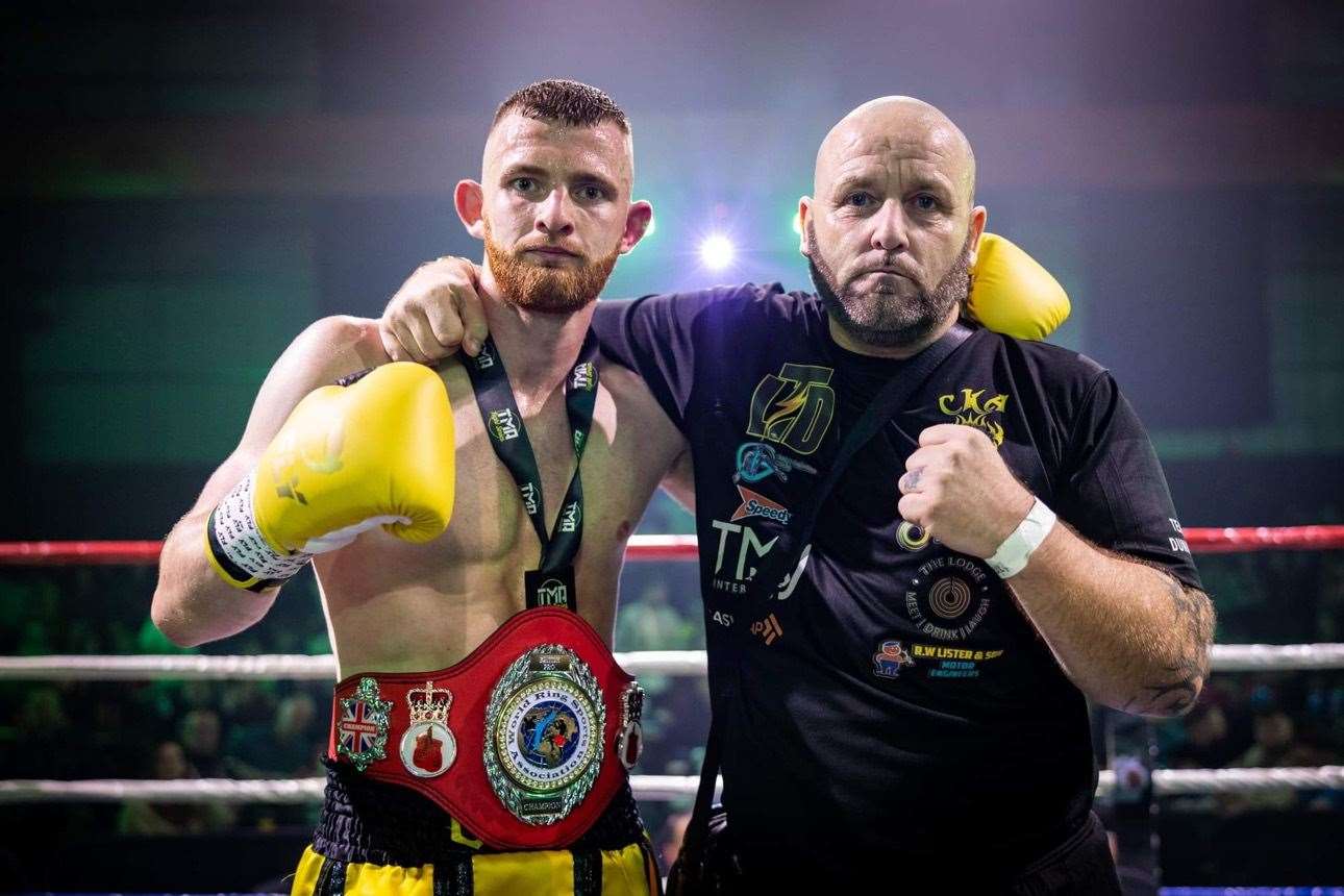 Leon Dunnett celebrates with coach and father Peter Dunnett after his British title victory