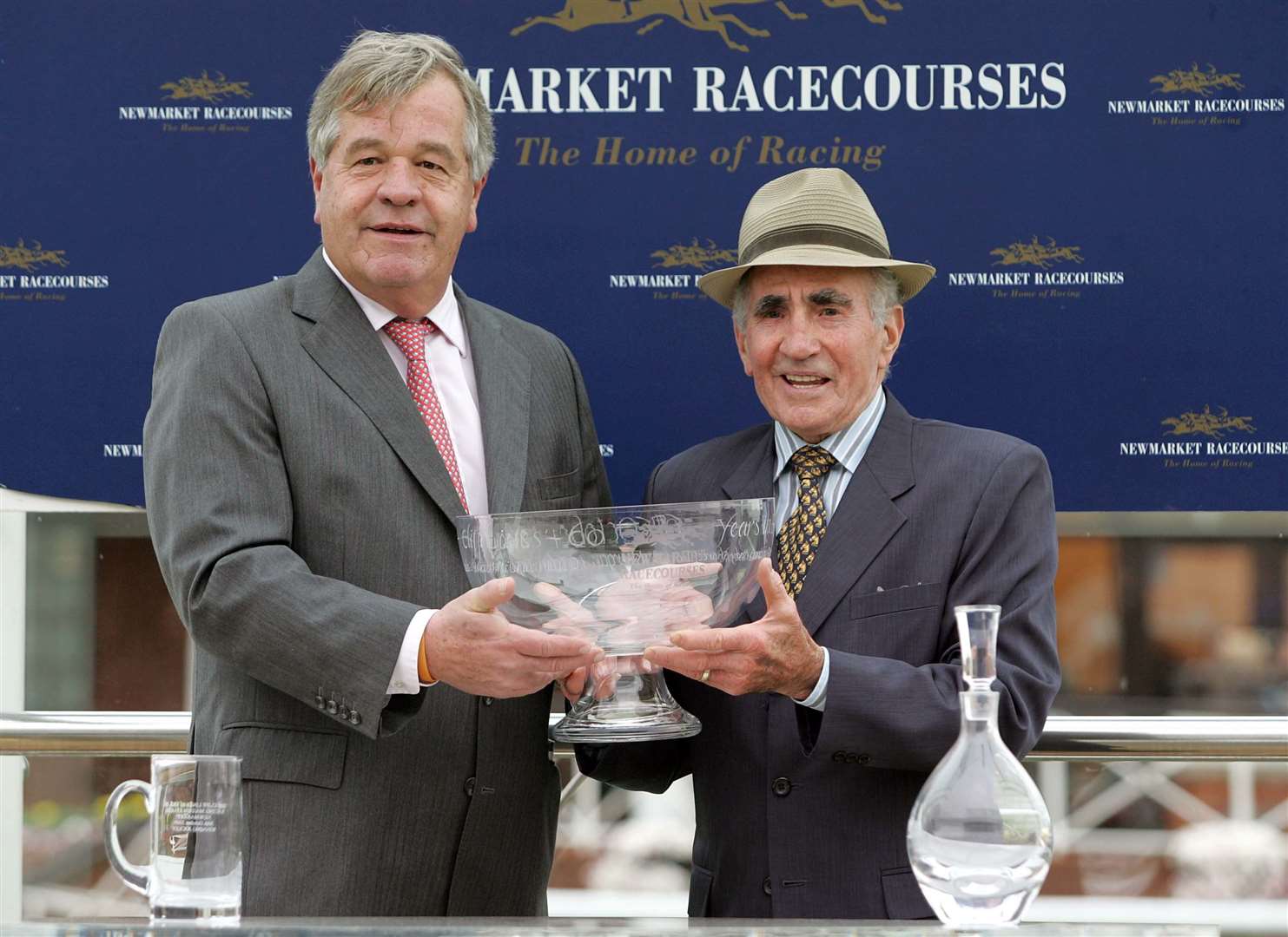 Sir Michael Stout presents Cliff Lines with a bowl to celebrate his 60 years in racing. Picture: Richard Marsham
